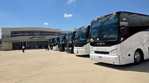ETI-supplied field photograph showing several motorcoaches lined up at an airport terminal